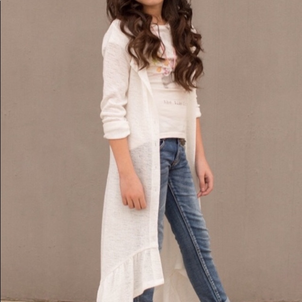 Joyfolie long, cream cardigan with ruffle hem.